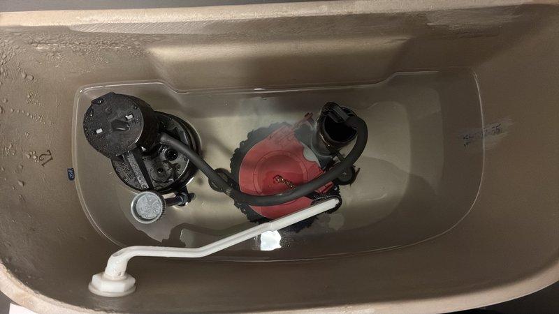 Responded to service call addressing three plumbing issues in residential bathrooms. Replaced faulty toilet flapper valve that was causing tank leakage, removing the stuck original flapper and installing new red rubber replacement component to restore proper seal and eliminate water waste. Installed customer-provided bathtub spout diverter assembly on Moen tub fixture after original water redirection mechanism failed, securing new brushed metal spout with proper mounting hardware. Reinstalled bathroom sink pop-up drain stopper assembly, reconnecting pivot rod and linkage to restore proper drain operation.