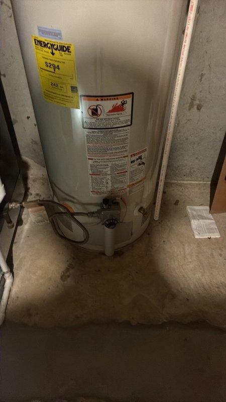 Conducted estimate for replacement of 10-year-old gas-fired tanked water heater located in basement. Current 40-gallon GE unit is operational but nearing end of service life. Documented existing installation including gas connections, venting system, and plumbing configuration. Assessed utility room conditions and clearances for new equipment installation. Provided specifications and pricing for replacement with comparable 40-gallon gas water heater.