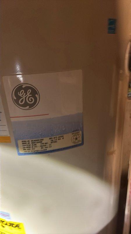 Conducted estimate for replacement of 10-year-old gas-fired tanked water heater located in basement. Current 40-gallon GE unit is operational but nearing end of service life. Documented existing installation including gas connections, venting system, and plumbing configuration. Assessed utility room conditions and clearances for new equipment installation. Provided specifications and pricing for replacement with comparable 40-gallon gas water heater.