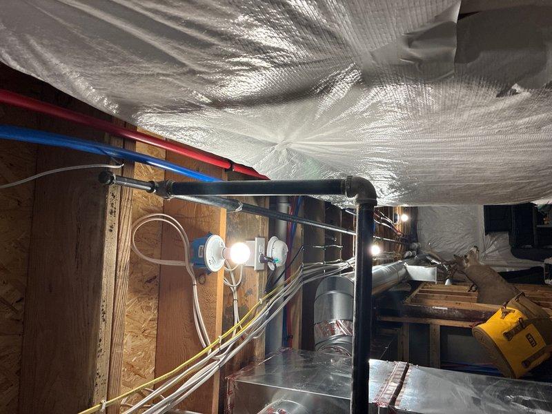 Installed new gas line to supply standby generator. Ran black iron pipe from existing gas meter through exterior wall penetration and terminated at generator connection point. Routed piping along building exterior with proper support brackets and performed pressure test to verify system integrity and code compliance.