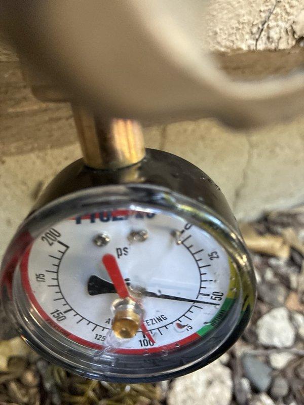 Performed plumbing maintenance visit on Rinnai tankless water heater system. Inspected unit operation, verified proper functioning of digital display showing temperature reading of 212°F, and examined all water supply connections with shutoff valves. Documented system pressure readings via mounted gauge showing parameters within normal operating range. Confirmed exhaust venting system integrity with PVC piping properly secured and all connections tight.