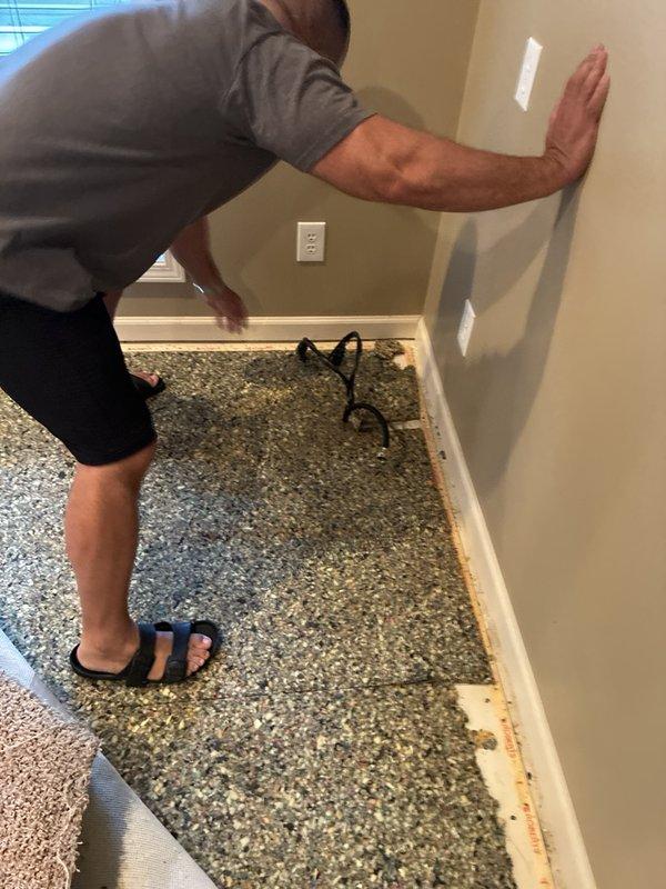 Conducted comprehensive assessment of 16-year-old sump pump system in residential basement to provide estimate for replacement unit. Evaluated existing operational pump, basin installation, discharge piping, and electrical connections. Documented significant moisture damage, water staining on surrounding floor joists and framing, and evidence of mold growth around basin perimeter, indicating historical water intrusion issues that will require remediation during pump replacement.