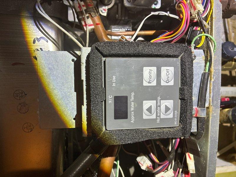Responded to no-power condition on tankless water heater unit located in basement. Diagnosed electrical issue at control module and verified power supply connections. Restored functionality to unit and confirmed proper operation of temperature controls and priority settings. Additionally provided estimate for main water valve replacement and bathroom valve repair as requested.