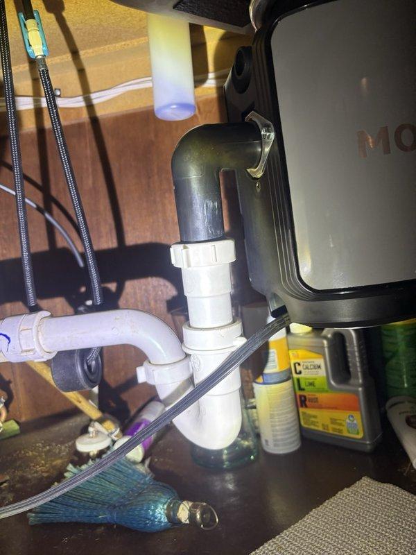 Responded to service call for failed garbage disposal unit in kitchen. Removed existing inoperative disposal and installed new replacement unit. Connected disposal to existing sink drain assembly and verified proper alignment with P-trap configuration. Tested unit operation and confirmed proper drainage with no leaks at connection points.