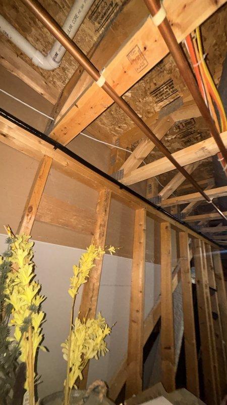 Installed approximately 70-80 feet of CSST flexible gas line, originating from a 1-inch gas nipple located near the furnace. Reduced the 1-inch nipple connection down to 3/4-inch and routed the gas line along ceiling rafters to the designated endpoint. Drilled through the floor structure, installed appropriate gas floor plate protection, and completed the installation with a gas shut-off valve for the stove connection.