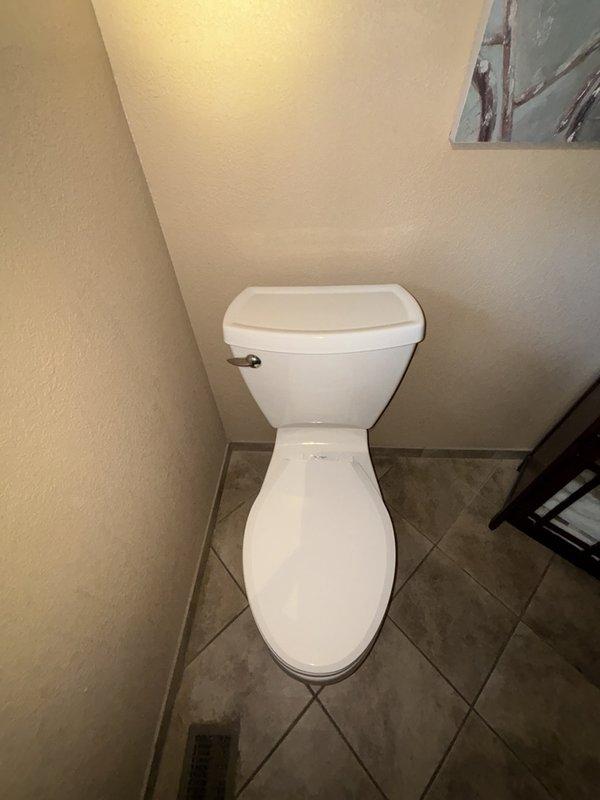 Responded to reported odor complaint originating from toilet in bathroom. Upon arrival, conducted thorough inspection of toilet fixture, wax ring seal, and flange connection. Identified source of smell as compromised wax ring seal at base of toilet allowing sewer gases to escape into bathroom. Removed toilet from floor flange, scraped old wax ring material, inspected flange for damage, and confirmed proper flange condition. Installed new wax ring seal and reset toilet to floor flange, ensuring proper alignment and secure mounting. Reconnected water supply line, tested flush operation, and verified complete seal with no leaks or odors present. Issue resolved successfully.