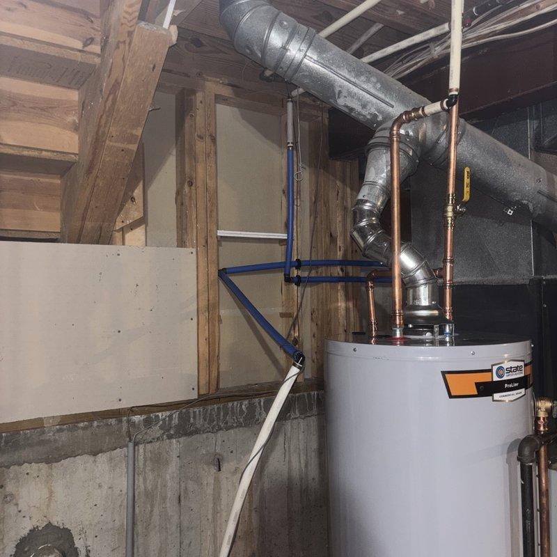 Completed installation of 40-gallon gas water heater with thermal expansion tank in basement utility area. Installed unit with proper copper supply line connections, brass fittings, and shutoff valves per code requirements. Connected thermal expansion tank to system to protect against pressure fluctuations and ensure compliance with plumbing standards. All connections tested and verified leak-free, unit operational and ready for service.