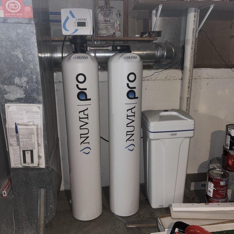 Completed installation of 40-gallon gas water heater with thermal expansion tank in basement utility area. Installed unit with proper copper supply line connections, brass fittings, and shutoff valves per code requirements. Connected thermal expansion tank to system to protect against pressure fluctuations and ensure compliance with plumbing standards. All connections tested and verified leak-free, unit operational and ready for service.