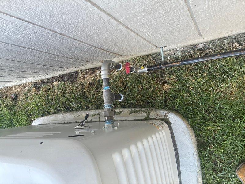 Installed new gas line from existing 1" gas main in unfinished basement to exterior generator unit. Installed gas shut-off valve at main connection point in basement and ran flash shield through exterior wall, connecting to black iron gas pipe. Routed gas line along concrete foundation wall to generator location, navigating around main electrical service panel. Secured gas line to wall using split rings and floor-to-ceiling plates for proper support. At generator connection point, installed gas shut-off valve, drip leg, and union fitting per code requirements. Completed pressure testing to verify system integrity and confirm no leaks present throughout entire installation.
