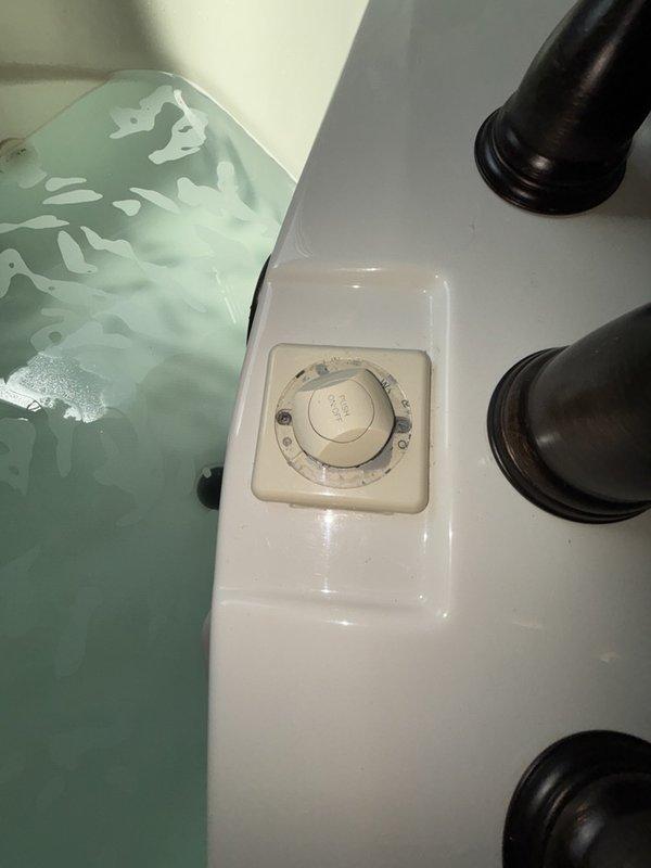Responded to service call for malfunctioning whirlpool tub air button that would not stick or stay engaged during operation. Inspected air actuator mechanism and button assembly to diagnose activation failure. Additionally assessed water heater condition, steam shower ventilation system, and washing machine vent lacking proper exterior caps to prevent cold air infiltration as noted by customer.
