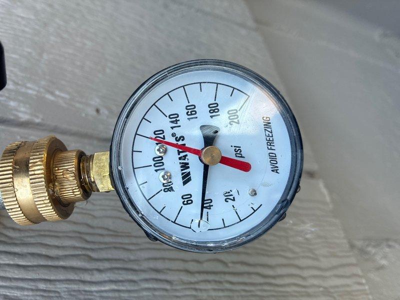 Conducted on-site assessment of 12-year-old gas water heater in basement to provide replacement estimate for 50-gallon capacity unit. Inspected existing installation including pressure gauge readings, expansion tank condition, copper supply lines, gas connections, and venting system. Documented current system configuration and photographed equipment to develop comprehensive replacement proposal.