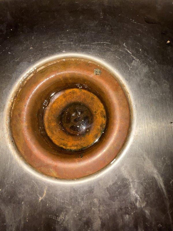 Responded to service call for clogged kitchen sink on the non-disposal side. Upon arrival, assessed the drainage issue and inspected the affected sink basin, which showed significant mineral buildup and staining around the drain assembly. Cleared the obstruction using appropriate drain cleaning methods to restore proper water flow. Additionally, provided estimate for washer valve replacement and bathroom sink plumbing repairs as requested. Verified kitchen sink drainage was functioning properly upon completion of work.