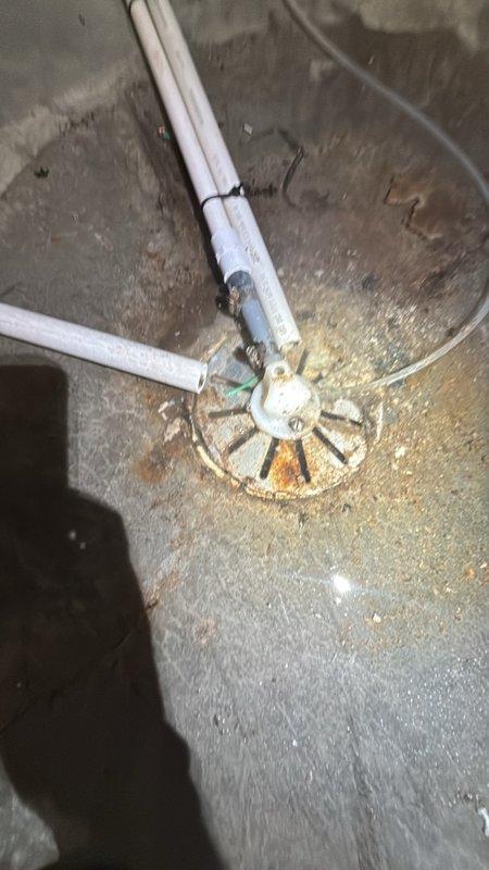 Responded to a clogged floor drain in the basement. Upon inspection, found the main drain cleanout assembly showing signs of backup with visible water staining and moisture on the surrounding concrete floor. Successfully cleared the obstruction from the floor drain system, restoring proper drainage flow through the PVC drain lines connected to the cleanout assembly.