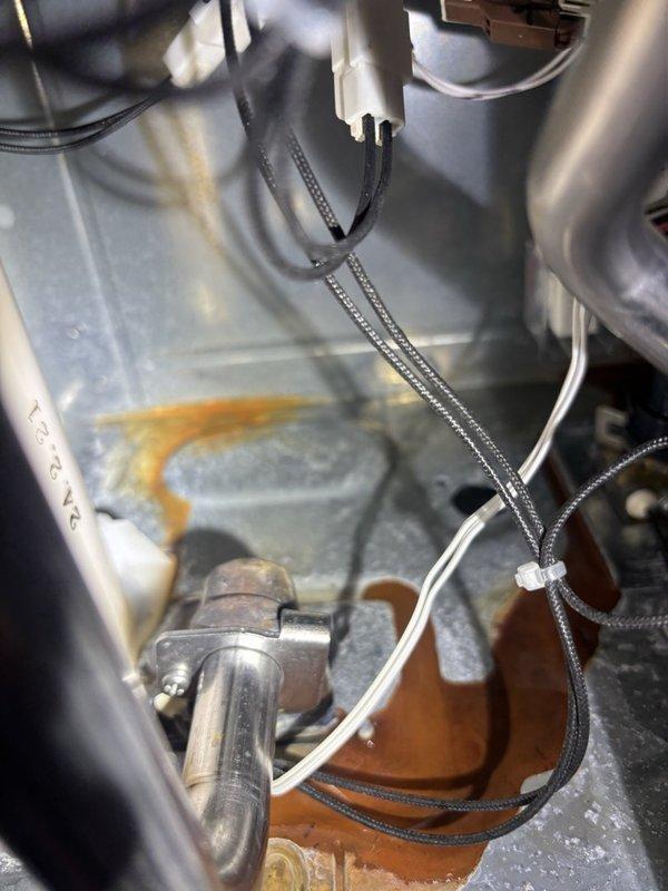 Responded to service call for tankless water heater with no hot water and ignition failure. Upon inspection, identified faulty flame rod connector causing intermittent electrical connection and preventing proper ignition sequence. Removed and replaced defective connector with new unit, ensuring proper pin alignment and secure locking mechanism. Tested system operation through multiple heating cycles, confirmed successful ignition, and verified consistent hot water delivery. Unit restored to full operational status.