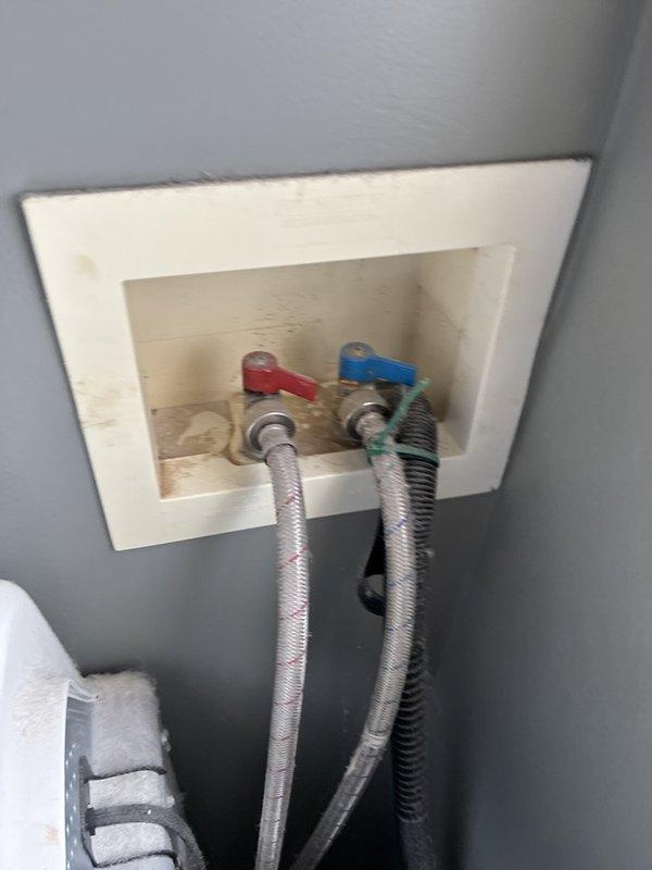 Responded to complaint of sewer odor in upper bedroom. Conducted thorough inspection of plumbing system including water heater, supply lines, and accessible plumbing connections. Inspected wall-mounted plumbing access panel containing hot and cold water shut-off valves with braided supply lines. Examined basement mechanical room plumbing infrastructure including water heater connections, copper piping, expansion tank, and associated shut-off valves. Documented existing plumbing configuration with photos for reference. Unable to identify definitive source of sewer gas odor during this visit; recommend further investigation of drain traps, vent stack system, and wax ring seals at toilet fixtures in upper level to isolate odor source.