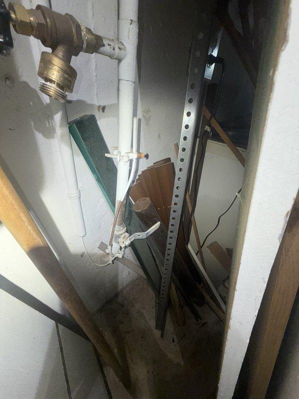 Responded to a burst frozen pipe in the basement utility area. Upon arrival, water supply was already shut off by the homeowner. Located the damaged section of copper piping that had frozen and ruptured, removed the compromised segment, and installed new copper pipe with brass fittings and proper soldered connections. Pressure tested the repair to ensure no leaks and restored water service to the residence. Additionally, repaired a leaky faucet as requested during the same visit by replacing worn internal components and washers. All work completed successfully with systems functioning properly upon departure.