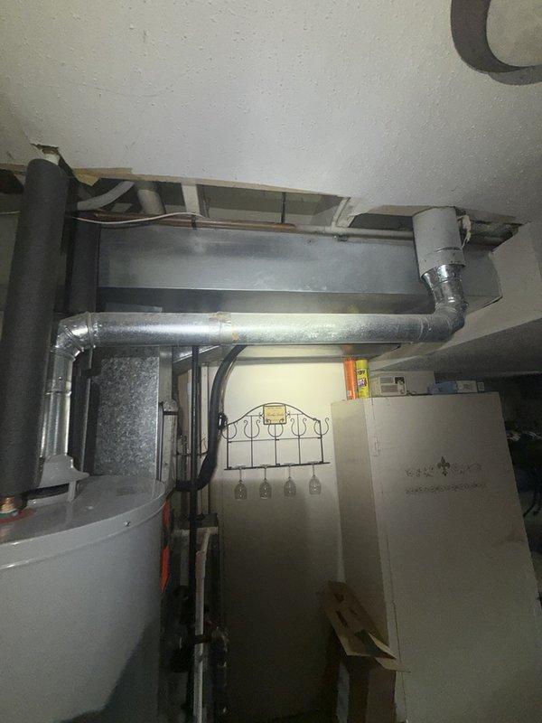 Responded to a burst frozen pipe in the basement utility area. Upon arrival, water supply was already shut off by the homeowner. Located the damaged section of copper piping that had frozen and ruptured, removed the compromised segment, and installed new copper pipe with brass fittings and proper soldered connections. Pressure tested the repair to ensure no leaks and restored water service to the residence. Additionally, repaired a leaky faucet as requested during the same visit by replacing worn internal components and washers. All work completed successfully with systems functioning properly upon departure.