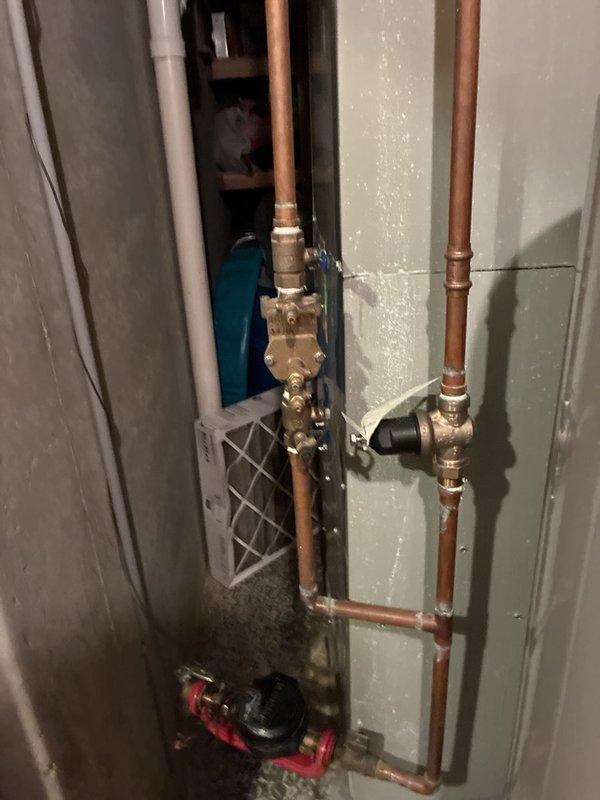 Completed comprehensive plumbing maintenance inspection of residential property. Evaluated interior hot water circulation system including copper piping, brass fittings, control valves, and circulation pump in basement utility area, confirming proper operation and connections. Inspected exterior plumbing connections at building perimeter, including hose bibs and irrigation valve assembly, verifying functionality and seasonal readiness of outdoor water supply system.
