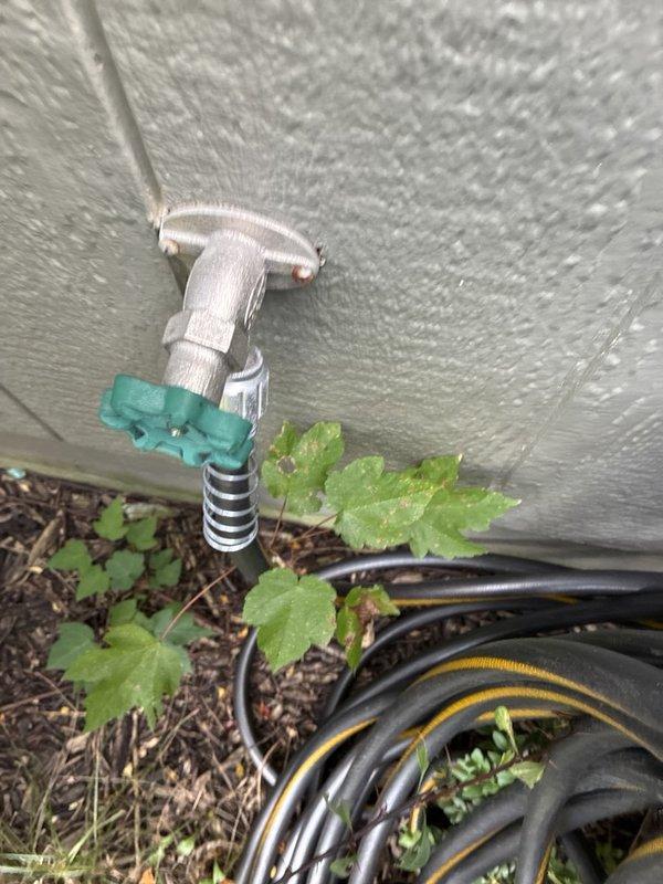 Completed comprehensive plumbing maintenance inspection of residential property. Evaluated interior hot water circulation system including copper piping, brass fittings, control valves, and circulation pump in basement utility area, confirming proper operation and connections. Inspected exterior plumbing connections at building perimeter, including hose bibs and irrigation valve assembly, verifying functionality and seasonal readiness of outdoor water supply system.