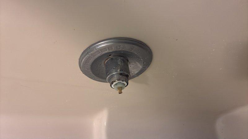 Responded to main bathroom shower handle that would not shut off completely, causing continuous water leakage in tub that was progressing from dripping to potential stream flow. Upon inspection, diagnosed faulty valve cartridge preventing proper water shutoff. Removed shower trim and handle assembly, extracted worn cartridge, and installed replacement cartridge to restore full shutoff function. Tested hot and cold water operation to verify complete seal and proper handle operation. Leak eliminated and shower valve now functioning to manufacturer specifications.