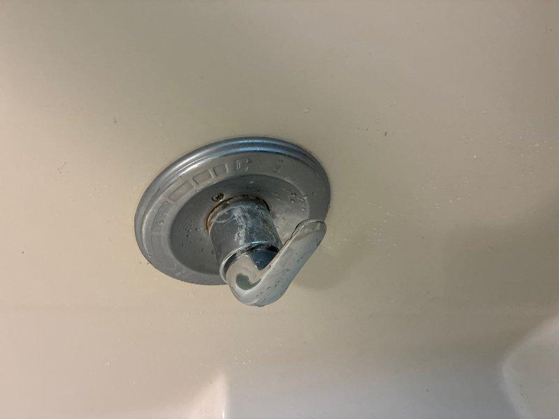 Responded to main bathroom shower handle that would not shut off completely, causing continuous water leakage in tub that was progressing from dripping to potential stream flow. Upon inspection, diagnosed faulty valve cartridge preventing proper water shutoff. Removed shower trim and handle assembly, extracted worn cartridge, and installed replacement cartridge to restore full shutoff function. Tested hot and cold water operation to verify complete seal and proper handle operation. Leak eliminated and shower valve now functioning to manufacturer specifications.