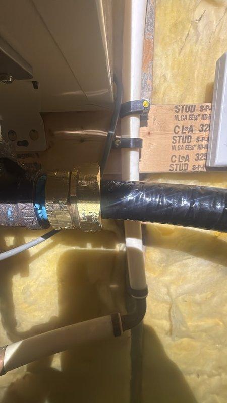 Responded to address improperly bonded CSST (Corrugated Stainless Steel Tubing) gas line serving tankless water heater installation. Upon inspection, confirmed yellow flexible gas line lacked required electrical bonding to protect against lightning strikes and electrical surges per manufacturer specifications and code requirements. Installed approved bonding clamp and grounding conductor to establish proper electrical continuity between CSST gas piping system and electrical grounding system. Verified secure connections at bonding points and confirmed compliance with NFPA 54 and manufacturer guidelines for gas line protection in residential utility area.