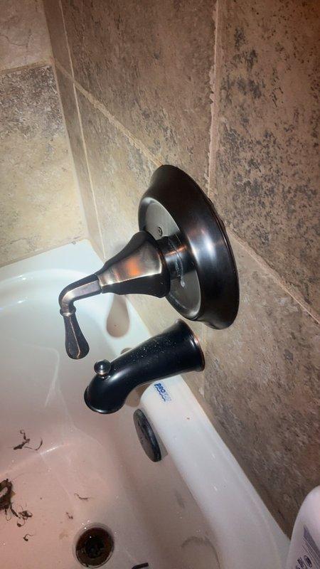 Responded to service call for low water pressure issues affecting multiple fixtures in Jack and Jill bathroom. Investigated bedroom sink with adequate cold water pressure but restricted hot water flow, as well as bathtub with insufficient water pressure on both hot and cold supply lines. Inspected shower fixture and tub assembly, examining for potential aerator blockages, valve restrictions, or sediment buildup in supply lines. Documented existing conditions including mineral deposits and fixture wear that may be contributing to inconsistent water flow and temperature control issues.