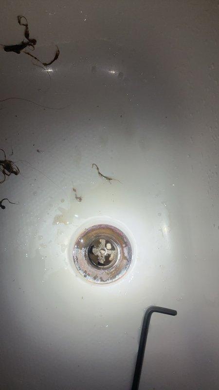 Responded to service call for low water pressure issues affecting multiple fixtures in Jack and Jill bathroom. Investigated bedroom sink with adequate cold water pressure but restricted hot water flow, as well as bathtub with insufficient water pressure on both hot and cold supply lines. Inspected shower fixture and tub assembly, examining for potential aerator blockages, valve restrictions, or sediment buildup in supply lines. Documented existing conditions including mineral deposits and fixture wear that may be contributing to inconsistent water flow and temperature control issues.