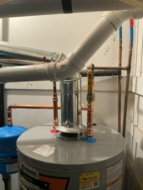 Conducted on-site assessment of existing gas water heater located in utility area, which was over 10 years old and required replacement. Evaluated current 40-gallon State brand automatic storage water heater installation, documented existing plumbing configuration including copper supply lines, pressure relief valve connections, and gas line setup. Provided comprehensive estimate for new gas water heater installation with appropriate capacity specifications to meet household requirements.