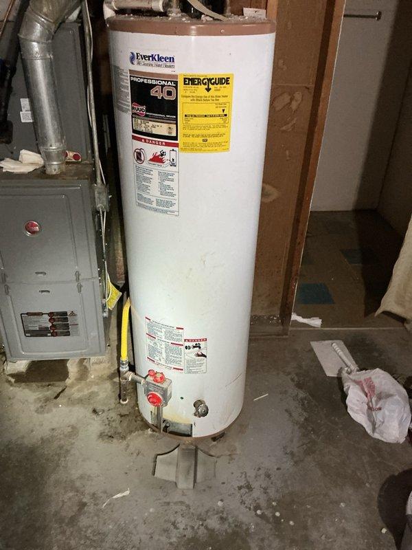 Conducted on-site assessment of existing EverKleen water heater for replacement estimate. Inspected current installation including tank condition, plumbing connections, gas/electrical supply lines, venting system, and clearance requirements. Evaluated flexible corrugated connector, pressure relief valve piping, and shut-off valves at base of unit. Documented existing configuration and utility connections in unfinished basement mechanical room. Photographed water heater specifications, EnergyGuide label, and surrounding infrastructure to provide accurate replacement quote. Noted concrete floor conditions and accessibility for equipment removal and new installation.