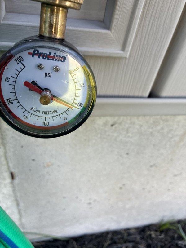 Performed routine plumbing maintenance inspection on residential Guardian water heater system. Evaluated system pressure using calibrated gauge, verified proper operation of shut-off valves and brass fittings, and documented existing copper pipe connections with insulation. All components found to be functioning within normal parameters.