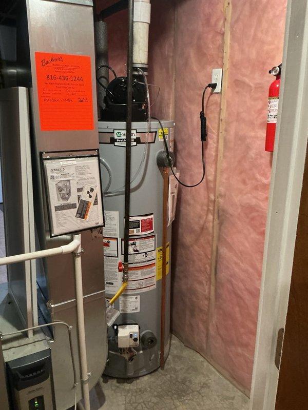 Completed installation of a 50-gallon power vent water heater with thermal expansion tank in basement utility area. Connected all necessary plumbing lines including copper water supply piping, installed yellow-handled gas shutoff valve, and routed flexible gas connector to unit. Mounted thermal expansion tank to system to protect against pressure buildup from thermal expansion in closed plumbing systems. Installed power vent exhaust system with PVC venting to safely remove combustion gases. Verified all connections for proper operation, tested gas line for leaks, confirmed adequate combustion air supply, and ensured unit met all local code requirements for clearances and safety devices.