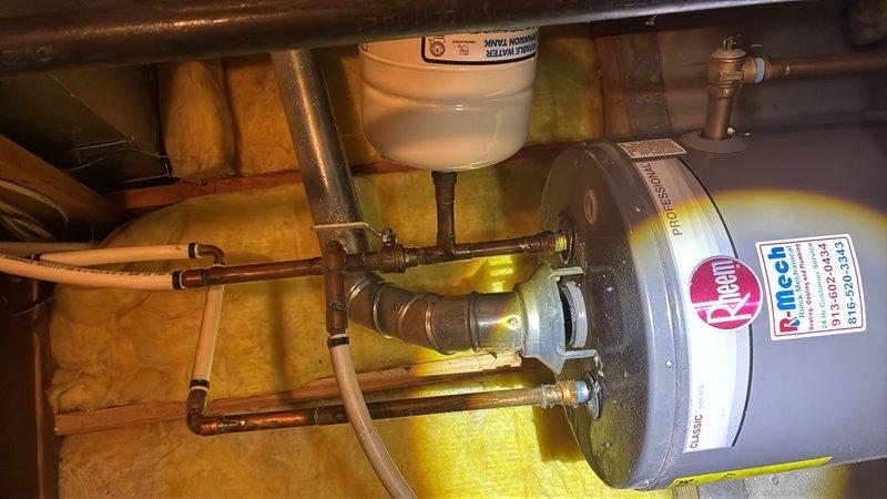Responded to reported water heater leak in basement. Upon arrival, inspected Rheem/Ruud gas-fired water heater and associated plumbing connections. Identified source of leak and performed necessary repairs to resolve the issue. Verified all copper piping, brass fittings, valves, and expansion tank connections for proper operation. Tested system for leaks following repair completion and confirmed water heater returned to normal functioning condition.