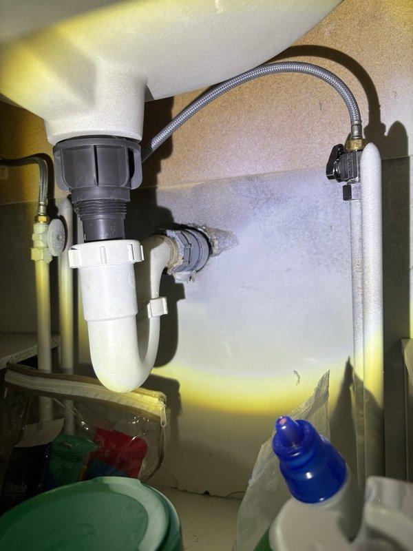 Completed comprehensive whole-home plumbing inspection at customer's request. Examined all accessible plumbing fixtures, supply lines, drain systems, and connections throughout the property. Under kitchen sink, verified P-trap integrity, checked braided stainless steel supply line connections for leaks or corrosion, and confirmed proper drainage function with no signs of moisture damage or active leaks present. In bathroom, inspected modern waterfall-style shower fixture during operation to verify proper water flow, pressure, and spray pattern; confirmed wall-mounted fixture secure with no leaks at mounting plate or connection points. Examined visible plumbing components including shut-off valves, drain assemblies, and water supply lines for signs of wear, corrosion, or potential failure points. All inspected plumbing systems found to be functioning properly with no immediate repairs required at time of inspection.