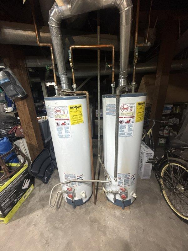 Responded to low water pressure complaint in second-floor bathroom bathtub. Inspected bathtub faucet fixture and plumbing connections, identifying restricted flow issue. Serviced chrome-plated tub spout and verified proper water pressure restoration from dual water heater system supplying the residence.
