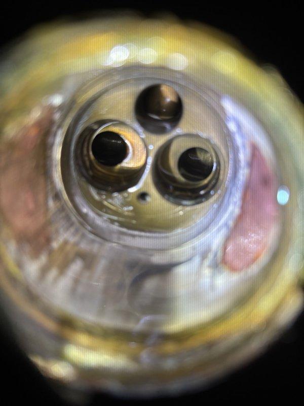 Responded to callback for shower leak near shower head assembly. Upon inspection, removed and examined the shower valve cartridge, which showed signs of wear and mineral buildup in the internal ports. Disassembled the valve trim and escutcheon to access the cartridge assembly. Identified compromised seals and corrosion on the brass components causing water to bypass and leak from the shower head connection. Replaced the faulty cartridge, cleaned the valve body, and reassembled the fixture to restore proper water control and eliminate the leak.