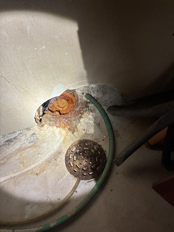 # Whole Home Plumbing Inspection

Conducted a comprehensive plumbing inspection of the residential property, documenting existing conditions and identifying areas requiring attention. Inspection revealed significant deterioration of basement plumbing fixtures, including advanced rust and corrosion on a white porcelain drain component with heavily corroded metal drain cover and visible water damage. Examined attic/crawl space infrastructure, documenting copper supply lines, HVAC ductwork integration, and overall plumbing system routing throughout the accessible areas of the home.