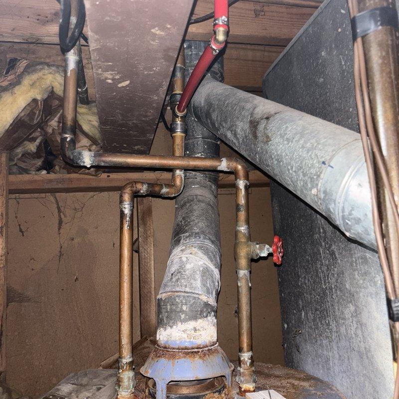Responded to service call for gas water heater with pilot light that would not remain lit in basement location. Upon inspection, diagnosed faulty thermocouple preventing proper flame sensing and causing safety shutoff. Replaced defective thermocouple assembly and tested pilot ignition system for proper operation. Verified main burner ignition, temperature control functionality, and gas valve operation. Unit tested and left in proper working condition with pilot light maintaining steady flame and water heater cycling normally.