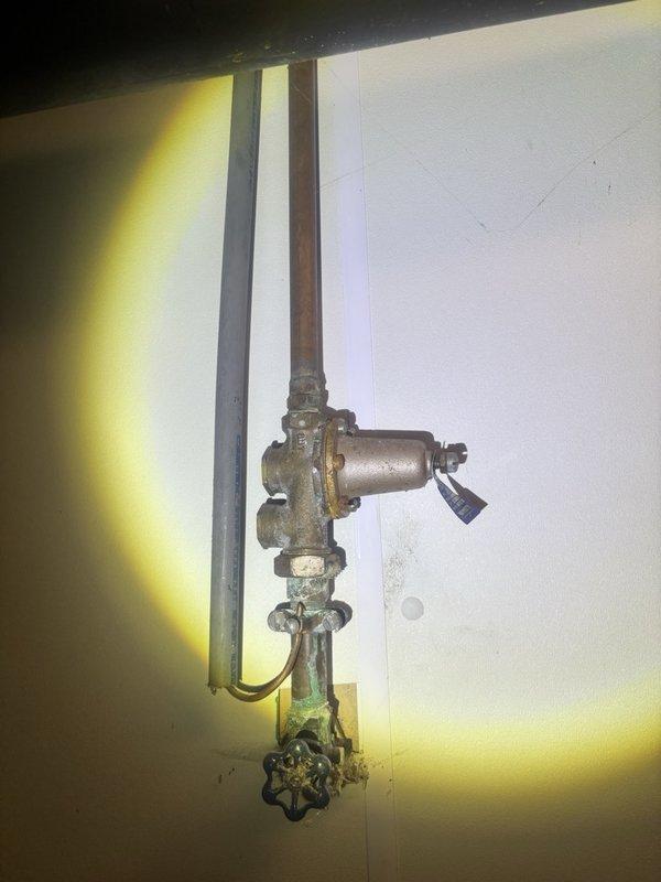 Completed on-site estimate for water heater replacement and customer-supplied toilet installation. Assessed existing water heater condition, documented aged copper supply lines with corroded valves and fittings, and inspected associated plumbing connections including condensate drainage system. Provided comprehensive quote for new water heater installation and toilet replacement work, with customer presenting available coupon for service discount.