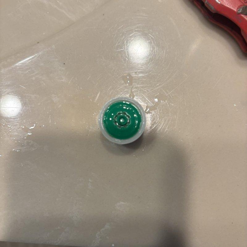 Responded to callback for low water pressure in hall bathroom following previous service visit. Upon inspection, discovered heavily clogged faucet aerator with significant mineral deposits, hard water scaling, and debris buildup restricting water flow. Removed and cleaned aerator, restoring full water pressure to fixture.