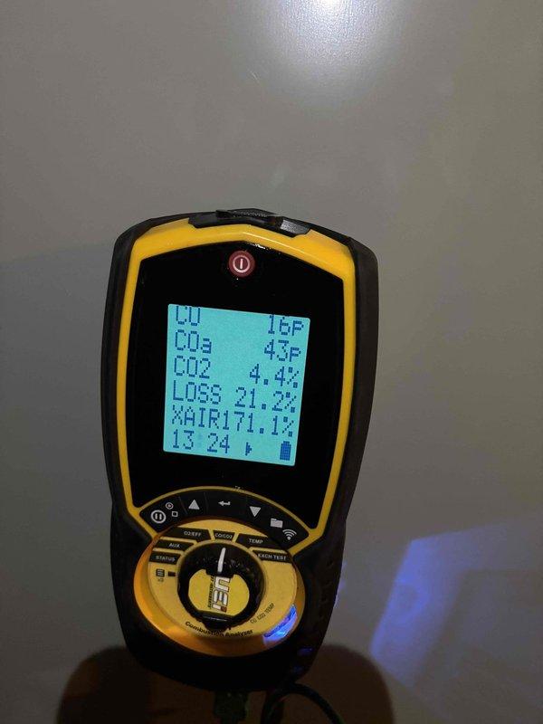 Completed comprehensive heating tune-up on basement furnace unit, including full system diagnostics with combustion analysis meter showing proper CO2 levels at 4.4% and oxygen at 21.3%. Performed flame sensor cleaning and inspection of all mechanical components to ensure safe and efficient operation for the heating season.
