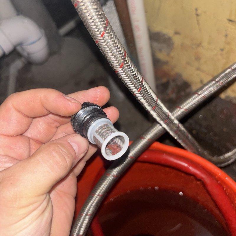 Performed routine maintenance on gas tankless water heater system, including complete flush procedure to remove mineral buildup and sediment accumulation. Replaced inline water filter element, removing old cartridge with visible debris and installing new mesh screen assembly to ensure proper water flow and filtration. All braided stainless steel flex lines and connections were inspected for integrity during service, and system was tested for proper operation upon completion.