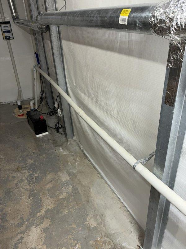 Completed scheduled plumbing maintenance inspection of residential utility systems. Inspected basement mechanical room including HVAC ductwork, insulated wall panels, PVC drainage lines, and associated equipment. Performed exterior plumbing system pressure testing using calibrated gauge to verify proper operation and identify potential issues.