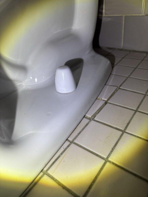 Responded to service callback for recently installed toilet with improperly secured floor mounting bolts. Tightened closet bolts at toilet base to manufacturer specifications and properly installed decorative caps to ensure secure fixture mounting. Verified toilet stability and inspected installation for proper seal and alignment.