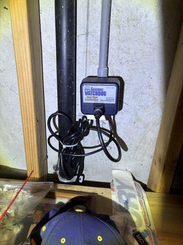 Completed plumbing maintenance visit addressing bathroom sink faucet operation and basement sump pump monitoring system inspection. Verified proper water flow from two-handle faucet fixture and confirmed basement watchdog alarm system was properly mounted and operational with secure power connections.