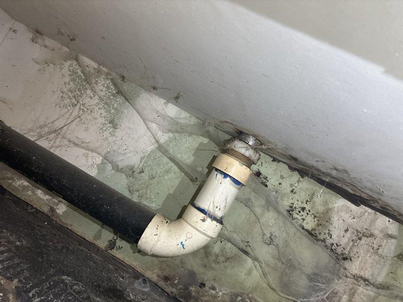 Completed installation of new tub overflow kit and p-trap assembly in bathroom plumbing system. Removed deteriorated existing drainage components and replaced with new PVC fittings and connections to restore proper drainage function. All connections were properly sealed and tested to ensure leak-free operation.