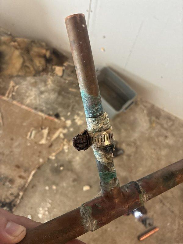 Completed installation of new tub overflow kit and p-trap assembly in bathroom plumbing system. Removed deteriorated existing drainage components and replaced with new PVC fittings and connections to restore proper drainage function. All connections were properly sealed and tested to ensure leak-free operation.