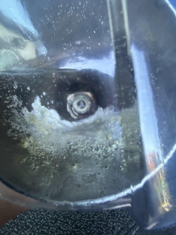 Responded to second floor bathroom for shower diverter malfunction where water discharged from both the tub spout and shower head simultaneously when attempting to activate shower mode. Inspected Delta shower system and tub spout with top-mounted diverter button. Diagnosed failed diverter mechanism in tub spout assembly preventing proper water flow redirection to shower head. Recommended replacement of tub spout to restore proper shower function.