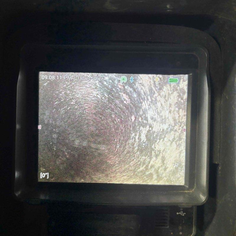 Responded to main line and toilet backup in basement/garage area. Performed video camera inspection of main drain line to diagnose recurring blockage issue that had been previously serviced by another company without resolution. Camera inspection revealed interior pipe conditions and confirmed line integrity with no root intrusion or structural damage detected in the accessible sections of the drainage system.