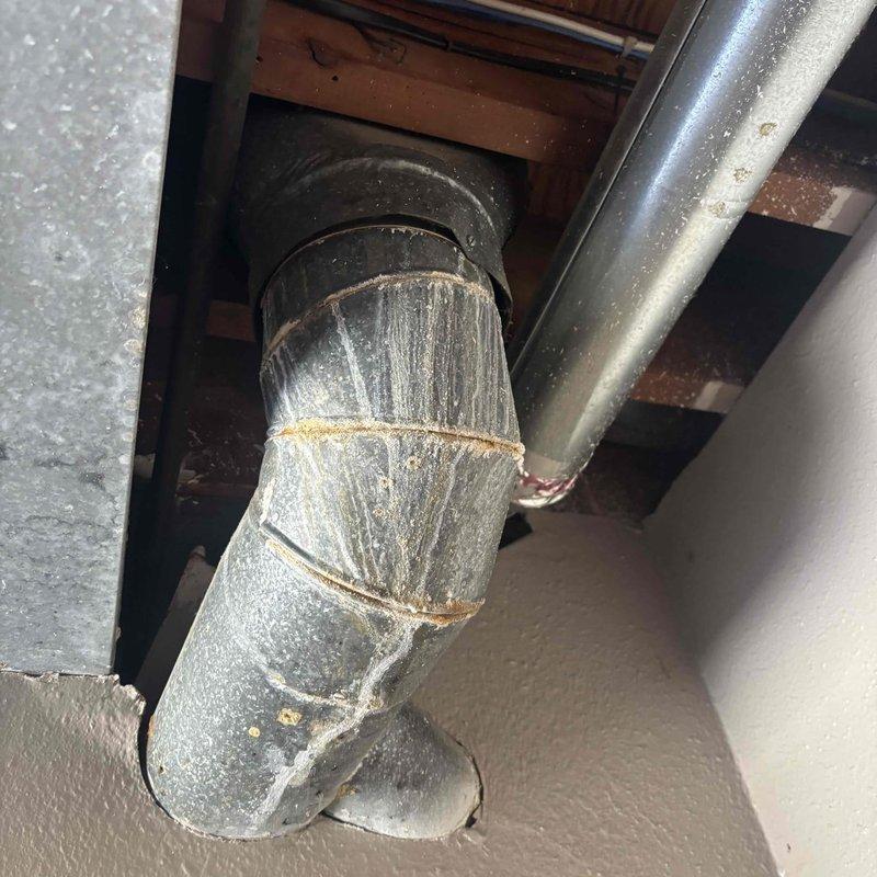 Conducted water heater replacement estimate for a gas unit over 20 years old located in the garage. Inspected existing operational water heater, evaluated surrounding plumbing connections including copper supply lines and associated ductwork infrastructure, and documented current installation conditions. Provided recommendations for replacement options based on capacity requirements and existing gas configuration.